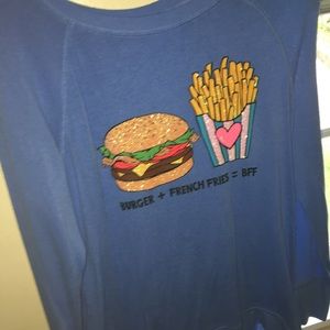 A blue justice long sleeve shirt